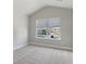 Bright bedroom with large window and carpet flooring at 485 Paces Dr, Lithia Springs, GA 30122