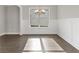 Formal dining room with hardwood floors, wainscoting, and chandelier at 485 Paces Dr, Lithia Springs, GA 30122