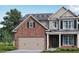 Two-story brick home with gray accents and a two-car garage at 485 Paces Dr, Lithia Springs, GA 30122
