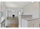 Open kitchen with granite island and view to living room at 485 Paces Dr, Lithia Springs, GA 30122