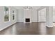 Spacious living room with hardwood floors and fireplace at 485 Paces Dr, Lithia Springs, GA 30122