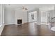 Open living room featuring hardwood floors and a fireplace at 485 Paces Dr, Lithia Springs, GA 30122