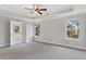 Spacious main bedroom with ceiling fan and en-suite bathroom at 485 Paces Dr, Lithia Springs, GA 30122