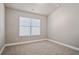 Bright bedroom with carpeted floors and a large window at 495 Paces Dr, Lithia Springs, GA 30122