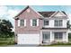 Two-story brick and shingle home with white accents and a three-car garage at 495 Paces Dr, Lithia Springs, GA 30122