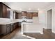Modern kitchen with dark cabinetry, granite countertops, and island at 495 Paces Dr, Lithia Springs, GA 30122