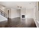 Spacious living room featuring hardwood floors, a fireplace, and large windows at 495 Paces Dr, Lithia Springs, GA 30122