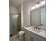 The bathroom has modern fixtures and a glass-enclosed shower at 515 Cottage Creek Dr, Cumming, GA 30040