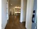 View of the kitchen with stainless steel appliances, hardwood floors, and pendant lighting at 515 Cottage Creek Dr, Cumming, GA 30040
