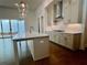 Kitchen with stainless steel appliances, white countertops, tile backsplash and sliding glass doors at 515 Cottage Creek Dr, Cumming, GA 30040