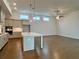 Open floor plan showing the kitchen, hardwood floors, recessed lighting, and ceiling fan at 515 Cottage Creek Dr, Cumming, GA 30040