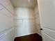 Walk-in closet with shelving and hardwood floors at 515 Cottage Creek Dr, Cumming, GA 30040