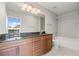 Bathroom features double vanity and soaking tub at 855 Peachtree Ne St # 2914, Atlanta, GA 30308