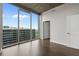 Bright bedroom with hardwood floors and floor to ceiling windows at 855 Peachtree Ne St # 2914, Atlanta, GA 30308