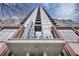 Modern high-rise building with glass and brick exterior at 855 Peachtree Ne St # 2914, Atlanta, GA 30308