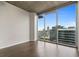 Living room with hardwood floors and expansive windows at 855 Peachtree Ne St # 2914, Atlanta, GA 30308