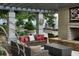 Relaxing rooftop patio with fireplace, seating area, and city views at 855 Peachtree Ne St # 2914, Atlanta, GA 30308