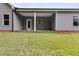 An outdoor covered patio overlooking a large grassy backyard at 8981 Callaway Dr, Winston, GA 30187