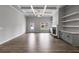 Bright living room features an open floor plan, custom built-ins, and luxury vinyl floors at 8981 Callaway Dr, Winston, GA 30187