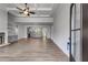 Spacious living room featuring an open floor plan, trey ceiling, and stone fireplace at 8981 Callaway Dr, Winston, GA 30187
