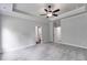 A carpeted main bedroom showcasing access to closet and bathroom areas at 8981 Callaway Dr, Winston, GA 30187