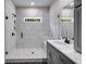A modern bathroom with a walk-in shower featuring gray subway tiles at 8981 Callaway Dr, Winston, GA 30187