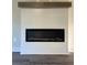 Modern electric fireplace with shiplap wall and wood mantle at 1790 Cassville Nw Rd, Cartersville, GA 30121