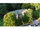 Aerial view showing townhouses nestled in a lush, wooded setting at 420 Old Holcomb Bridge Rd, Roswell, GA 30076