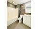 Updated bathroom with white vanity and grey tile at 420 Old Holcomb Bridge Rd, Roswell, GA 30076