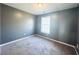 Spacious bedroom with neutral walls and carpet at 420 Old Holcomb Bridge Rd, Roswell, GA 30076