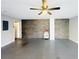 Garage interior with ceiling fan, gray flooring and a decorative stone wall at 420 Old Holcomb Bridge Rd, Roswell, GA 30076