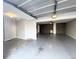Garage with an open layout and extra storage shelving at 420 Old Holcomb Bridge Rd, Roswell, GA 30076