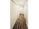 Bright hallway with hardwood floors and neutral-colored walls at 420 Old Holcomb Bridge Rd, Roswell, GA 30076