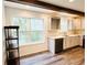 Modern kitchen with white cabinets, stainless steel appliances, and wood beams at 420 Old Holcomb Bridge Rd, Roswell, GA 30076