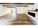 Spacious living room with wood beams, fireplace, and hardwood floors at 420 Old Holcomb Bridge Rd, Roswell, GA 30076