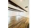 Bright living room with hardwood floors and exposed wood beams at 420 Old Holcomb Bridge Rd, Roswell, GA 30076