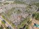 Aerial view of a property with a mix of wooded and open land at 490 Dorsey Road Rd, Hampton, GA 30228