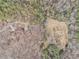 Birds-eye view of a property surrounded by trees and an open field at 490 Dorsey Road Rd, Hampton, GA 30228