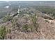 An aerial view of a property surrounded by trees and natural landscape at 490 Dorsey Road Rd, Hampton, GA 30228