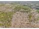 An aerial view of a wooded property with a long driveway at 490 Dorsey Road Rd, Hampton, GA 30228
