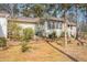 View of the backyard with a hammock and access to the home's back porch and sunroom at 490 Dorsey Road Rd, Hampton, GA 30228