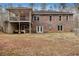 Two-story brick home with a spacious backyard, deck, and walk out basement at 490 Dorsey Road Rd, Hampton, GA 30228
