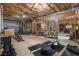 Unfinished basement featuring exposed ceiling, unfinished walls and weight lifting equipment at 490 Dorsey Road Rd, Hampton, GA 30228