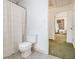 Functional bathroom featuring a toilet, tub/shower combo, and access to another room at 490 Dorsey Road Rd, Hampton, GA 30228