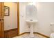 Cozy powder room with pedestal sink and tile flooring, perfect for guests at 490 Dorsey Road Rd, Hampton, GA 30228