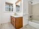 Well-lit bathroom featuring a vanity with storage, a tub, and a shower at 490 Dorsey Road Rd, Hampton, GA 30228