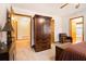 Relaxing bedroom featuring wood accents, a cozy armchair, and an ensuite bathroom at 490 Dorsey Road Rd, Hampton, GA 30228