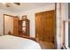 Spacious bedroom featuring wood bed frame, double door closet and ample storage space at 490 Dorsey Road Rd, Hampton, GA 30228