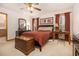 Inviting bedroom with warm colors, wood furniture, and an adjacent bathroom at 490 Dorsey Road Rd, Hampton, GA 30228