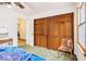 Bright bedroom featuring a large closet, neutral walls, and a clear chair at 490 Dorsey Road Rd, Hampton, GA 30228